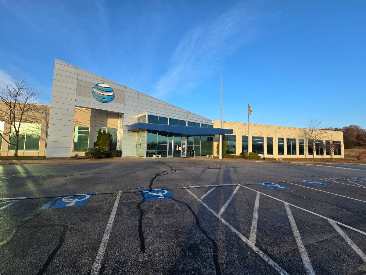 FSSB exterior: front entrance under the blue canopy, AT&T sign still on the building