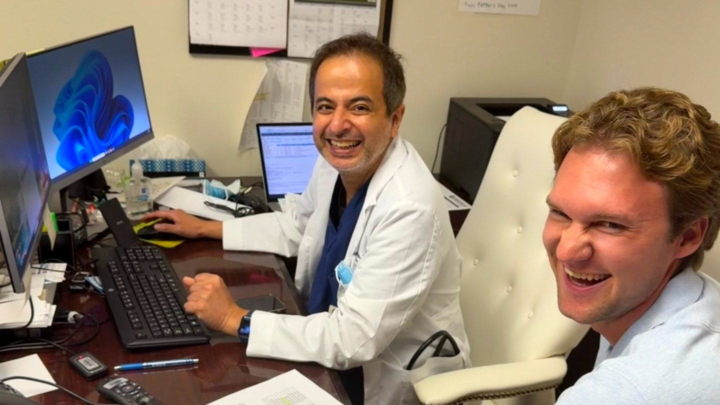 Dr. Muneeb of Nephrology at his workstation with Sean of the Epic team at a Workflow Dress Rehearsal