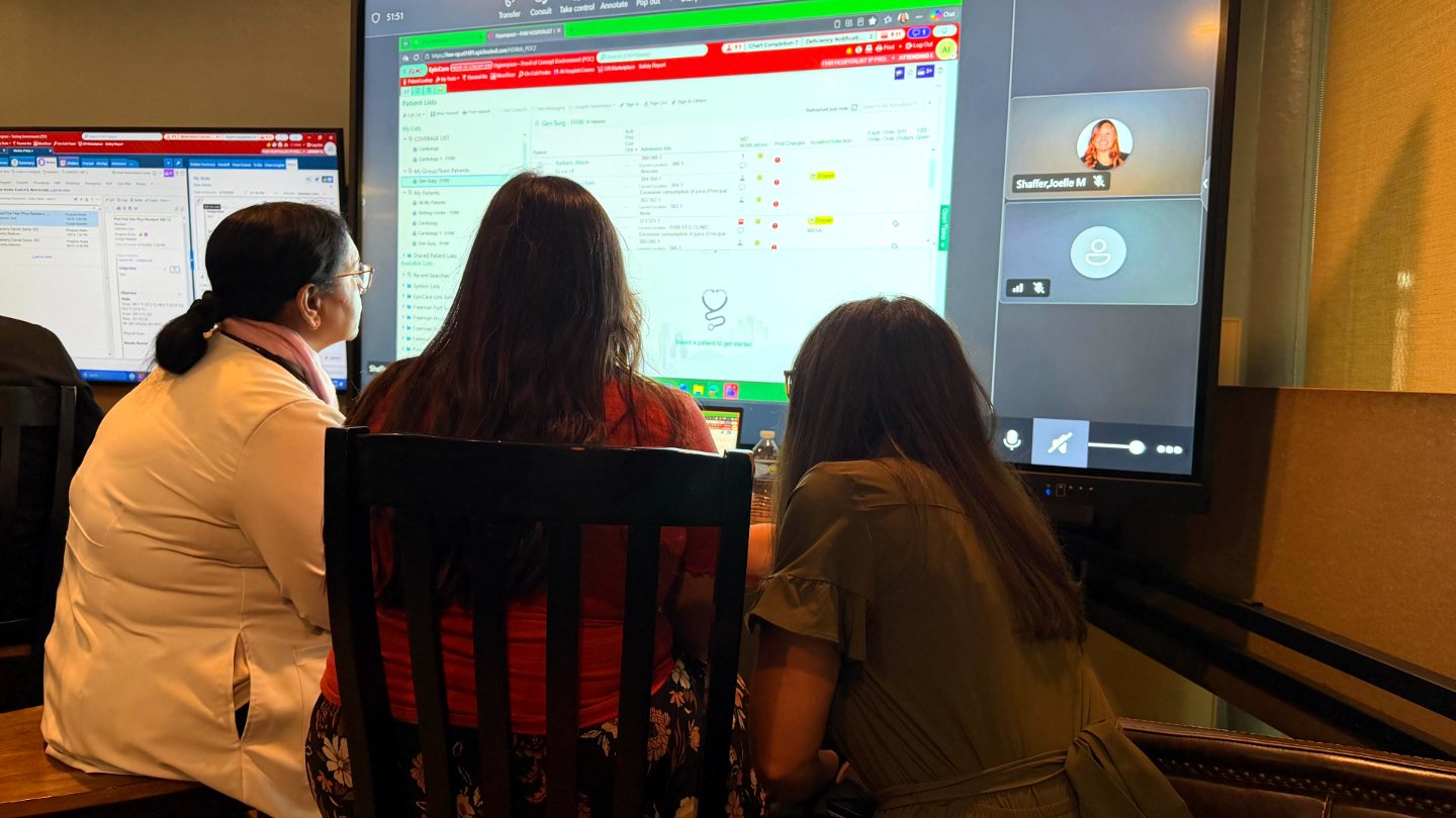 Dr. Shazia Naseem working in Epic with Joelle and Kaylee of the Epic team at a September Lunch and Learn